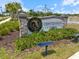 View of Centennial Park sign with well-kept landscaping at 1993 E Isles Rd, Port Charlotte, FL 33953
