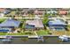 Aerial view of waterfront home featuring a private dock and screened-in pool area at 2100 Via Esplanade, Punta Gorda, FL 33950