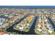 Stunning aerial view of waterfront homes along canals in a vibrant residential community with ocean view at 2100 Via Esplanade, Punta Gorda, FL 33950