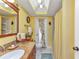 Bathroom features granite vanity top, large mirror, shower with curtain, and a unique ceiling design at 2100 Via Esplanade, Punta Gorda, FL 33950