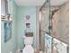 Bathroom with a glass-enclosed shower, beachy decor, and a modern toilet at 2100 Via Esplanade, Punta Gorda, FL 33950