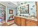 Coastal-themed bathroom with granite countertops and unique decorative touches at 2100 Via Esplanade, Punta Gorda, FL 33950