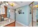 Well-lit bathroom with granite countertops and beach-themed decor at 2100 Via Esplanade, Punta Gorda, FL 33950