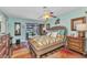 Comfortable bedroom with ceiling fan and view of the backyard pool at 2100 Via Esplanade, Punta Gorda, FL 33950