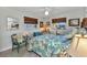 Cozy bedroom featuring a ceiling fan, two windows and nautical decorations at 2100 Via Esplanade, Punta Gorda, FL 33950