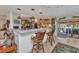 Kitchen with bar seating that provides an easy transition to outdoor dining near the pool at 2100 Via Esplanade, Punta Gorda, FL 33950