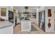 Bright kitchen with stainless steel appliances, white cabinets, and an island at 2100 Via Esplanade, Punta Gorda, FL 33950