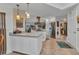 Modern kitchen with stainless steel appliances, white cabinets, and an open layout at 2100 Via Esplanade, Punta Gorda, FL 33950