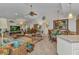 Inviting living room with an electric fireplace, dining table, and an open-concept design at 2100 Via Esplanade, Punta Gorda, FL 33950