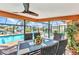A screened patio features an outdoor dining area with a pool view at 2100 Via Esplanade, Punta Gorda, FL 33950