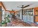 This covered patio has an outdoor dining area and a bar, overlooking the pool area at 2100 Via Esplanade, Punta Gorda, FL 33950