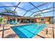 Inviting screened pool with lounge area, and access to dining area at 2100 Via Esplanade, Punta Gorda, FL 33950
