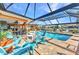 Inviting screened pool area with ample seating, and tranquil waterfront views at 2100 Via Esplanade, Punta Gorda, FL 33950