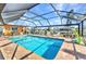Relaxing screened pool with ample sunlight and brick-paved deck at 2100 Via Esplanade, Punta Gorda, FL 33950