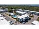 A scenic aerial view of a condominium community, showcasing a pool, parking, and lush greenery at 22375 Edgewater Dr # 123, Punta Gorda, FL 33980