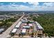 Wide aerial perspective showcasing the condo complex, pool, and surrounding area at 22375 Edgewater Dr # 123, Punta Gorda, FL 33980