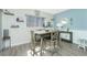 Charming dining area featuring a wooden table, decor shelves, and coastal accents for relaxed meals at 22375 Edgewater Dr # 123, Punta Gorda, FL 33980