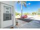 Condo entrance featuring a bright doorway, scenic views, and landscaping, creating a welcoming and picturesque arrival at 22375 Edgewater Dr # 123, Punta Gorda, FL 33980