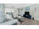 Inviting living room with modern furniture, wood-look floors, and an open layout to the kitchen at 22375 Edgewater Dr # 123, Punta Gorda, FL 33980