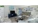 Bright living space with views from every angle featuring open dining, living, and adjacent exterior living space at 22375 Edgewater Dr # 123, Punta Gorda, FL 33980