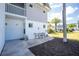Charming patio area with outdoor seating, a well-manicured lawn, and palm trees for a relaxing outdoor experience at 22375 Edgewater Dr # 123, Punta Gorda, FL 33980
