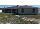 Home exterior showing backyard, screened-in patio and windows providing natural light to the home at 2250 Homestead Cir, North Port, FL 34286