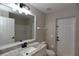 Bathroom featuring modern vanity with granite countertop and a shower at 2250 Homestead Cir, North Port, FL 34286