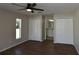 This bedroom has two closets, a ceiling fan, and a view into the attached bathroom at 2250 Homestead Cir, North Port, FL 34286