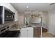 Modern kitchen with stainless steel appliances, stylish granite countertops, and white cabinetry at 2250 Homestead Cir, North Port, FL 34286