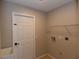Laundry room with utility sink and storage shelves at 2250 Homestead Cir, North Port, FL 34286