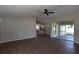 Open-concept living room with views to the kitchen and access to the lanai at 2250 Homestead Cir, North Port, FL 34286
