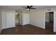 Spacious main bedroom with wood floors, ceiling fan, and double closets at 2250 Homestead Cir, North Port, FL 34286