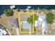 Aerial view of a residential property featuring a screened-in pool area and well-maintained landscaping at 2331 Cannolot Blvd, Port Charlotte, FL 33948