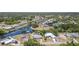 Aerial view of a residential neighborhood with waterfront access and lush greenery at 2331 Cannolot Blvd, Port Charlotte, FL 33948