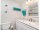 Bathroom featuring white vanity and coastal decor at 2331 Cannolot Blvd, Port Charlotte, FL 33948