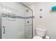 Bathroom featuring a walk-in shower with glass door at 2331 Cannolot Blvd, Port Charlotte, FL 33948