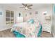 Bright bedroom featuring a window view and coastal decor at 2331 Cannolot Blvd, Port Charlotte, FL 33948