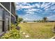 Beautiful backyard with lush landscaping and serene water views, perfect for outdoor enjoyment at 25225 Rampart Blvd # 1603, Punta Gorda, FL 33983