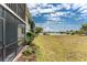 Lovely backyard space with a screened-in porch and scenic views of the tranquil lake at 25225 Rampart Blvd # 1603, Punta Gorda, FL 33983