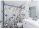 Cozy bathroom featuring a toilet, shower with nautical-themed curtain, and a sink with white vanity at 25225 Rampart Blvd # 1603, Punta Gorda, FL 33983