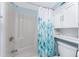 Cozy bathroom with a shower/tub combination and a nature-themed shower curtain at 25225 Rampart Blvd # 1603, Punta Gorda, FL 33983