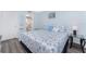 Comfortable bedroom featuring a coastal quilt, glass side tables, and relaxing decor at 25225 Rampart Blvd # 1603, Punta Gorda, FL 33983