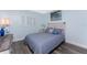 Light and airy bedroom featuring a coastal theme, updated flooring, and bright white window shutters at 25225 Rampart Blvd # 1603, Punta Gorda, FL 33983