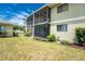 Exterior view showing screened patio, manicured landscaping and private backyard space at 25225 Rampart Blvd # 1603, Punta Gorda, FL 33983