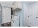 Hallway with ample storage space, including overhead cabinets, and access to other rooms at 25225 Rampart Blvd # 1603, Punta Gorda, FL 33983