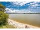 Beautiful lake view with a sandy shoreline, perfect for relaxation and enjoying the scenery at 25225 Rampart Blvd # 1603, Punta Gorda, FL 33983