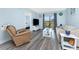 Living room features sliding glass doors and neutral decor at 25225 Rampart Blvd # 1603, Punta Gorda, FL 33983