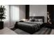Luxurious primary bedroom with a dark upholstered bed, plush bedding, and modern accents at 2523 Ryan Blvd, Punta Gorda, FL 33950