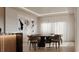 Elegant dining room with modern art, contemporary lighting, and comfortable seating for eight at 2523 Ryan Blvd, Punta Gorda, FL 33950
