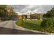 Eye-catching exterior view with detailed landscaping, a patterned driveway, and a blue car parked in front of the garage at 2523 Ryan Blvd, Punta Gorda, FL 33950